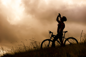 cyclist hydrating in the heat