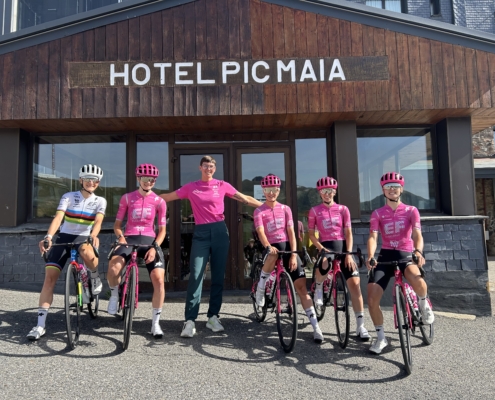 Dietitian Kristen Arnold standing with pro cycling team outside Hotel Pic Maia.
