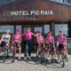 Dietitian Kristen Arnold standing with pro cycling team outside Hotel Pic Maia.